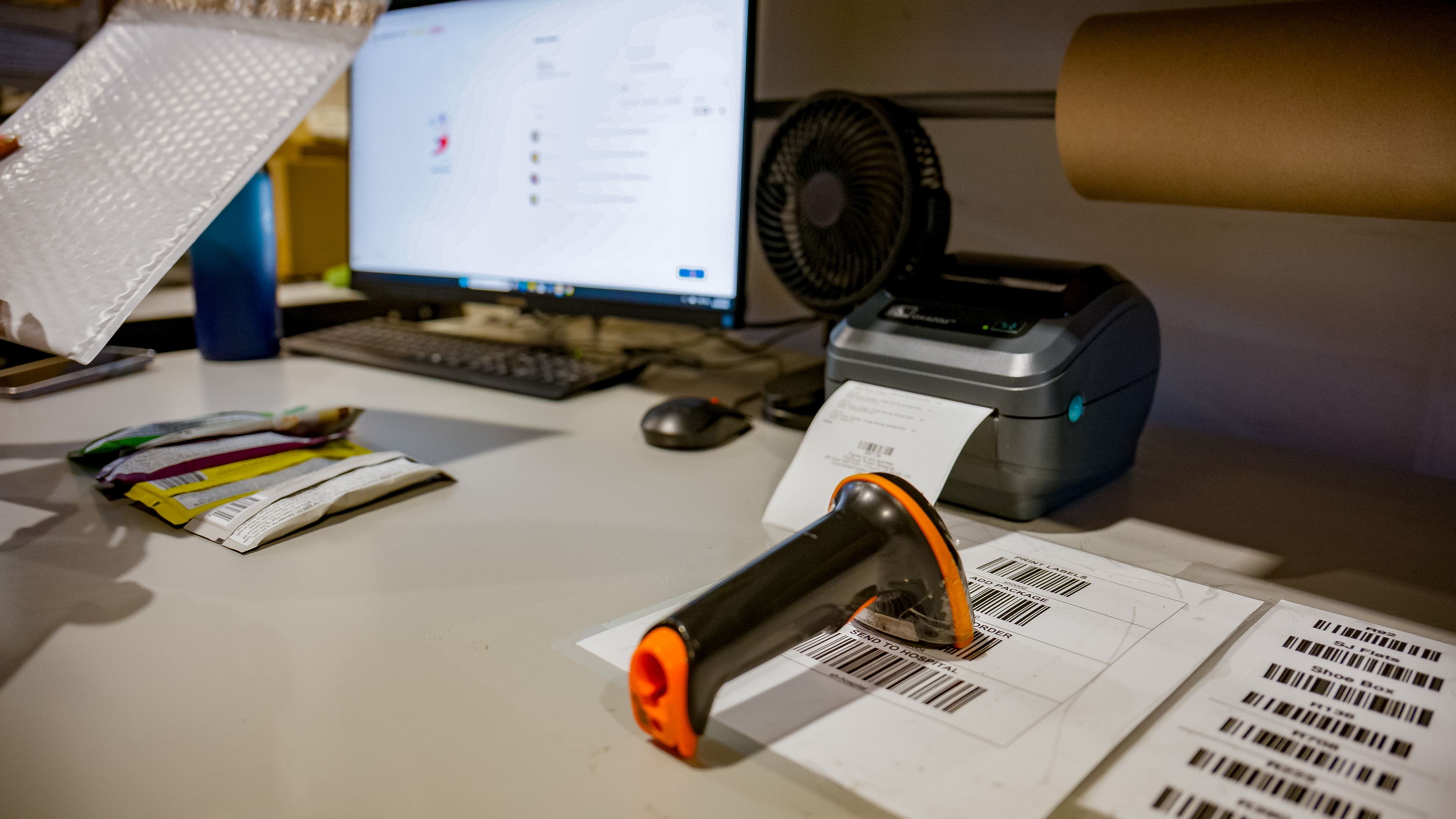 Pack and ship workstation with label printer and scanner