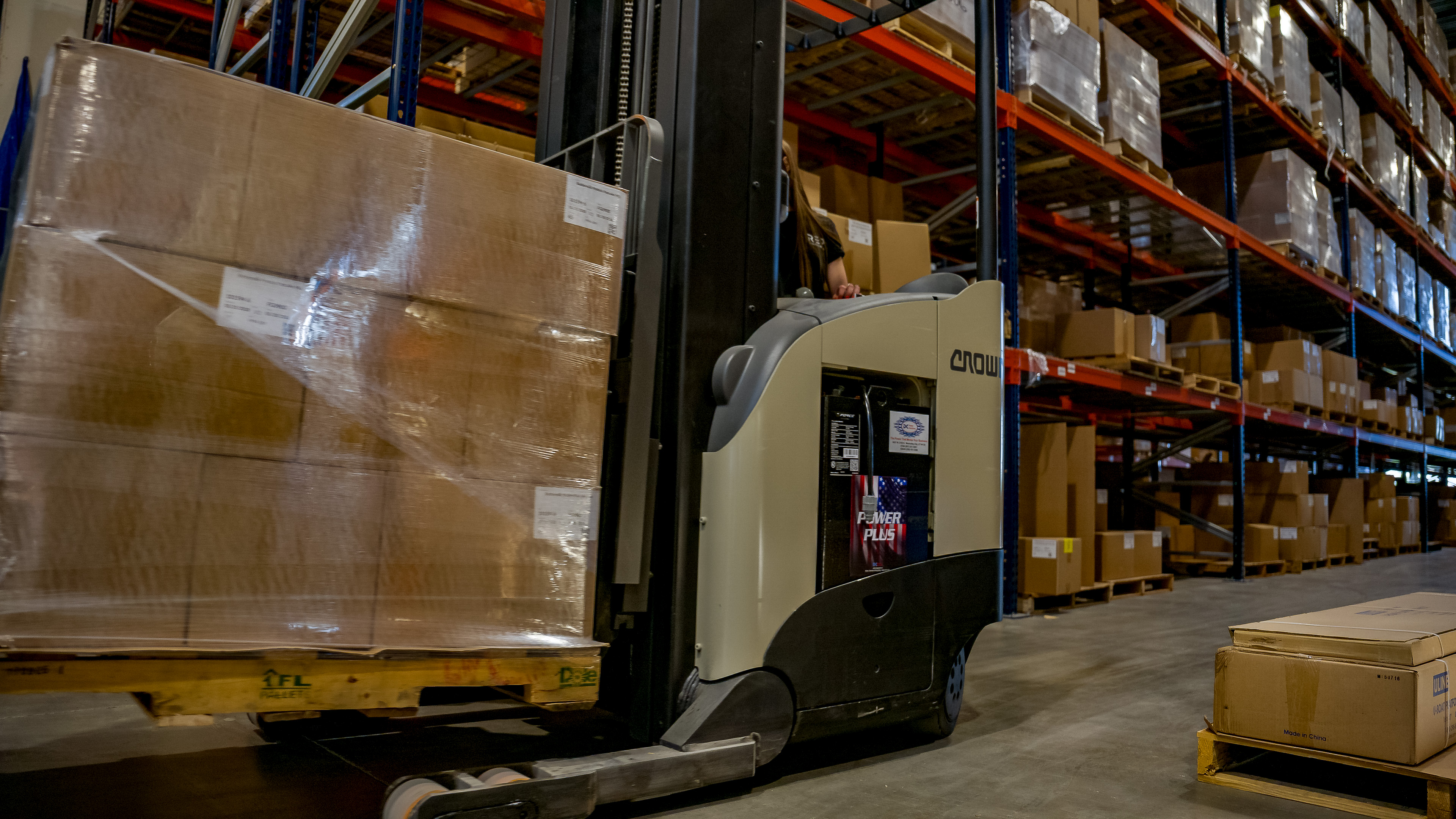 Moving a wrapped pallet with a reach truck
